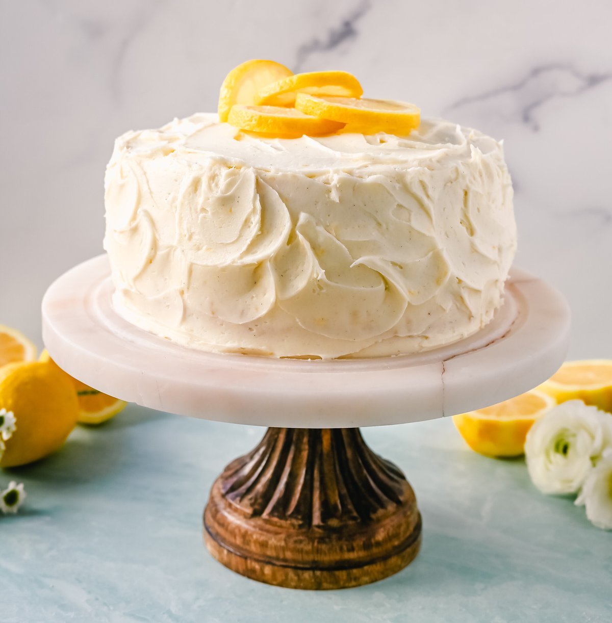 The Best Lemon Cake Recipe is moist, light, and fluffy made with fresh lemon juice and layered with lemon curd and lemon cream cheese frosting. This is the lemon cake of your dreams!