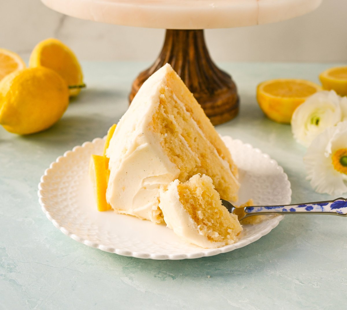 The Best Lemon Cake Recipe is moist, light, and fluffy made with fresh lemon juice and layered with lemon curd and lemon cream cheese frosting. This is the lemon cake of your dreams!