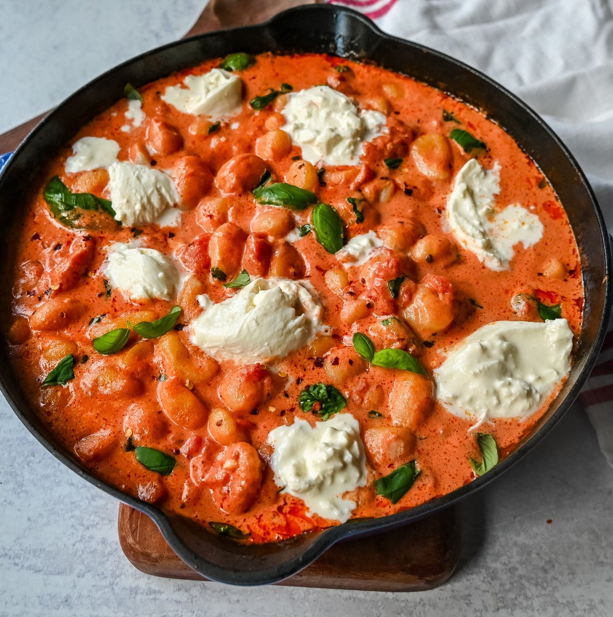 Creamy Tomato Gnocchi with Burrata. This easy 20-minute Creamy Tomato Gnocchi is made with a vibrant tomato garlic sauce tossed with cream, fresh basil, and gnocchi and topped with fresh burrata cheese. A simple, quick, and easy dinner full of flavor!