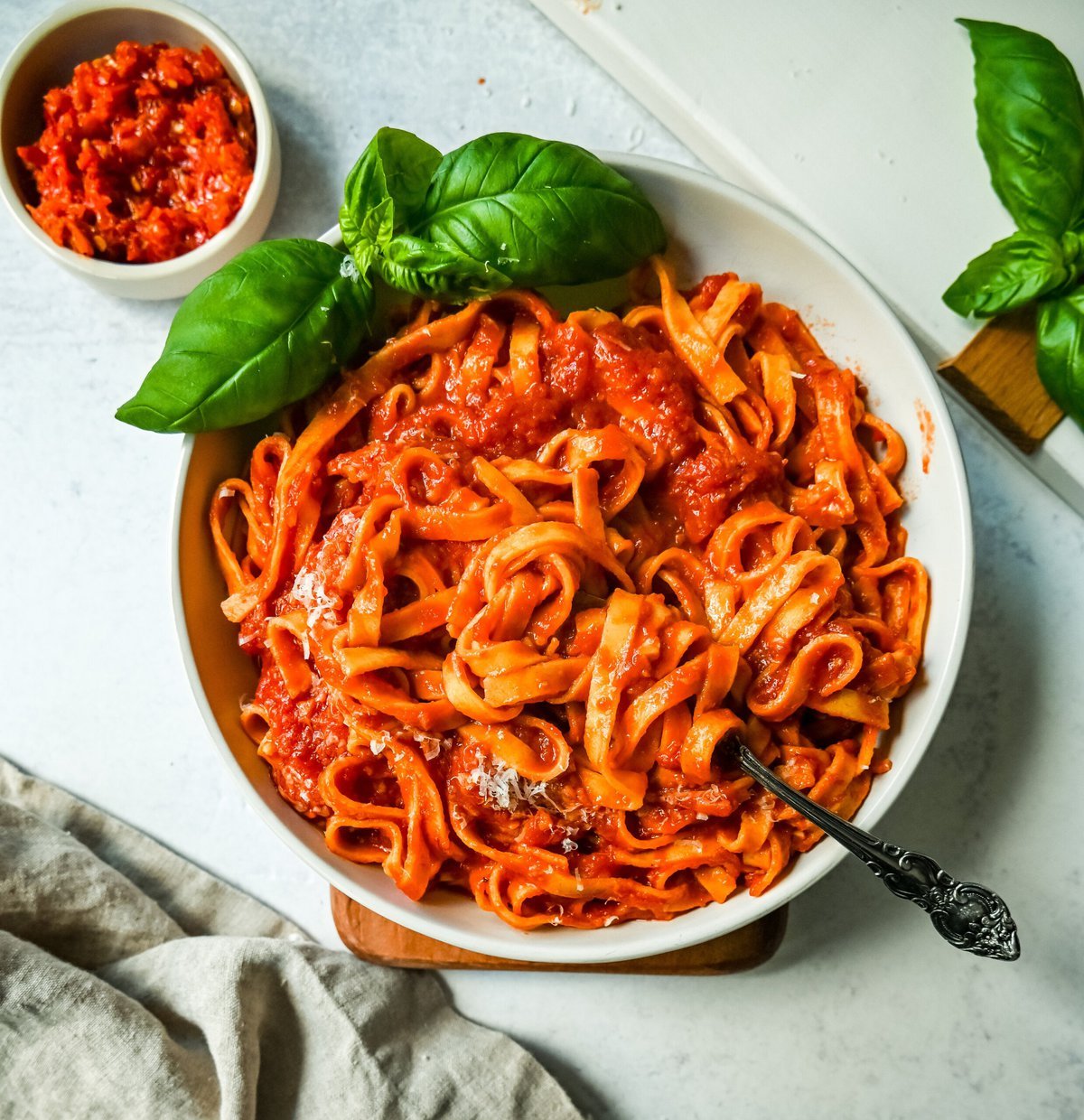 Mi Amor Spicy Pasta. This homemade spicy arrabbiata sauce is made with chopped calabrian chilies for the perfect amount of heat, tossed with fresh pasta and topped with Parmigiano Reggiano cheese and fresh basil. This is the perfect spicy pasta recipe!