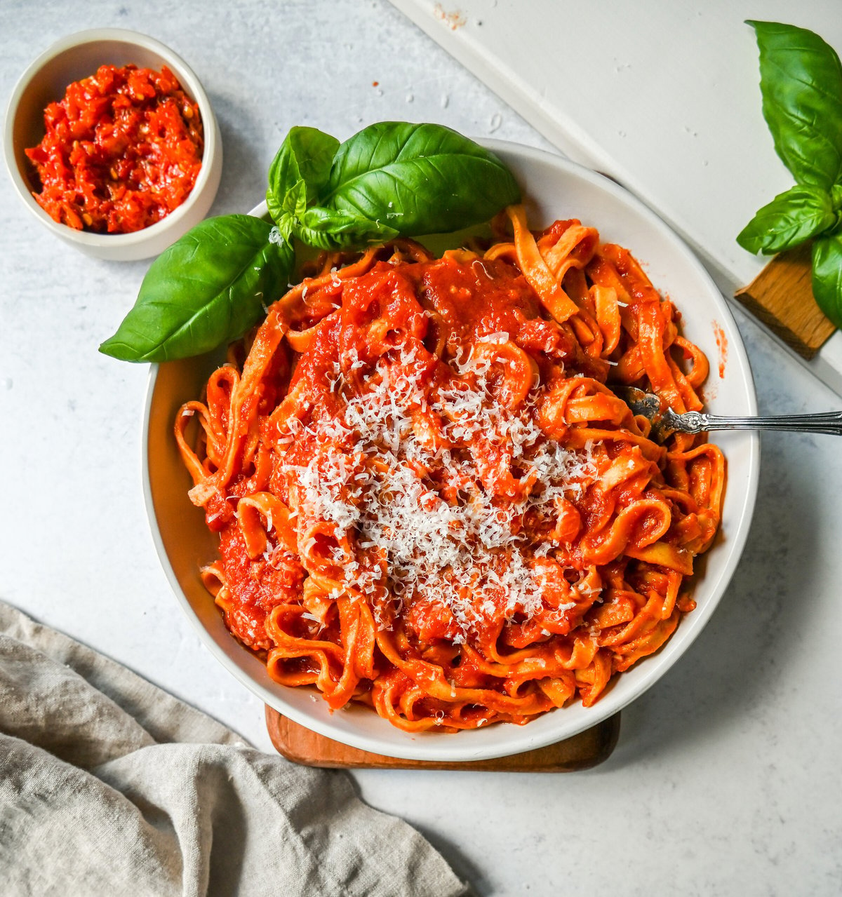 Mi Amor Spicy Pasta. This homemade spicy arrabbiata sauce is made with chopped calabrian chilies for the perfect amount of heat, tossed with fresh pasta and topped with Parmigiano Reggiano cheese and fresh basil. This is the perfect spicy pasta recipe!