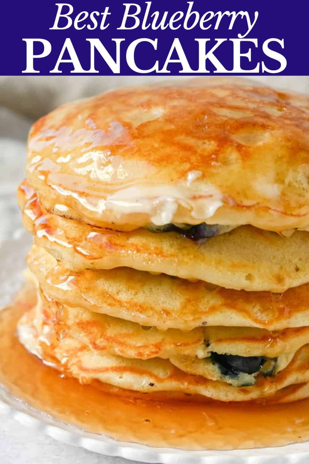 Homemade fluffy blueberry pancakes are made with fresh blueberries and are the best buttermilk blueberry pancakes ever! These are easy blueberry pancakes made from scratch.