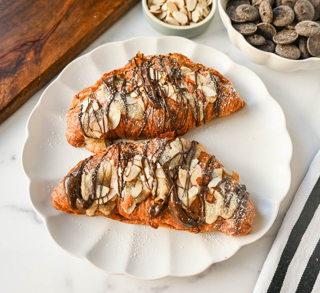 Easy Chocolate Almond Croissants. These quick and easy chocolate almond croissants use a shortcut by using day old croissants and filling them with a homemade almond filling and rich, decadent chocolate and baking until warm. These are the best almond chocolate croissants!