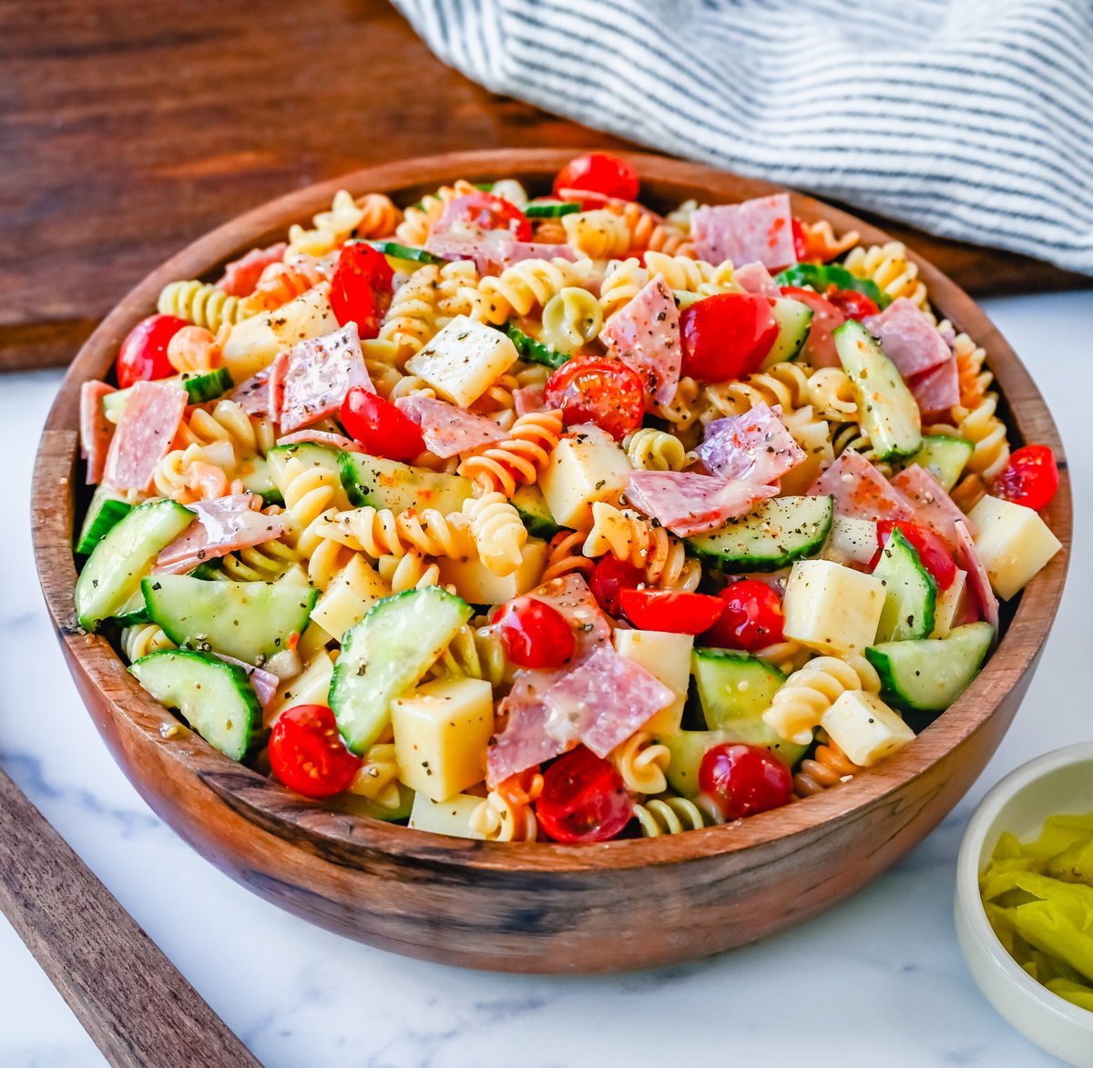 Easy Pasta Salad. This Quick and Easy Pasta Salad Recipe is made with pasta, fresh vegetables, cheese, salami, all tossed with a secret ingredient and Olive Garden Italian dressing. It is the best pasta salad recipe and the most flavorful side dish.