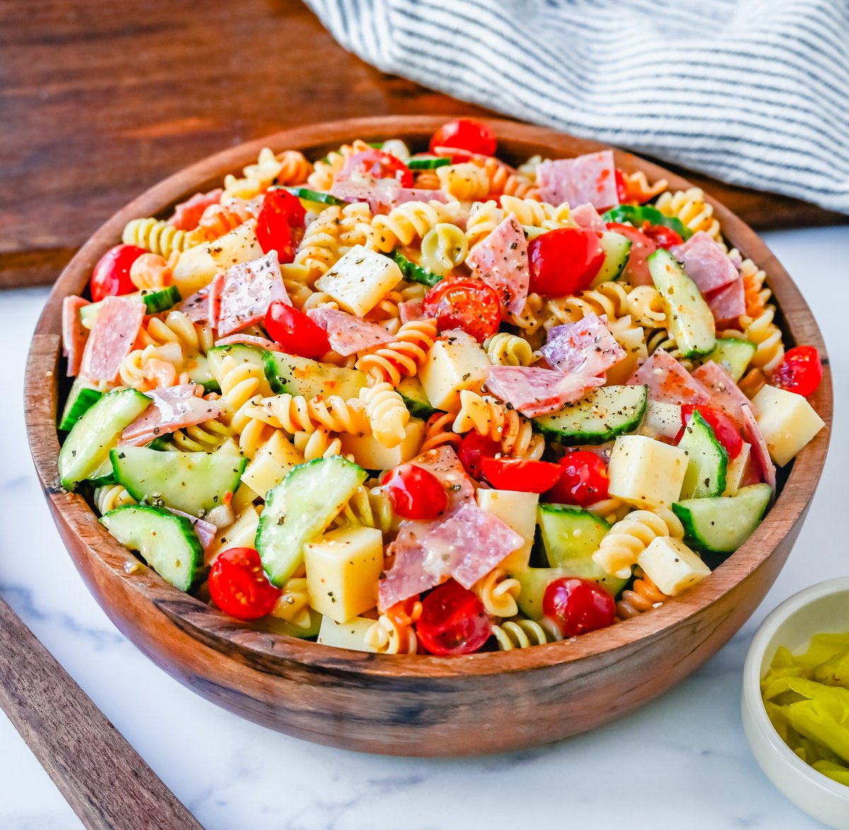 Easy Pasta Salad. This Quick and Easy Pasta Salad Recipe is made with pasta, fresh vegetables, cheese, salami, all tossed with a secret ingredient and Olive Garden Italian dressing. It is the best pasta salad recipe and the most flavorful side dish.