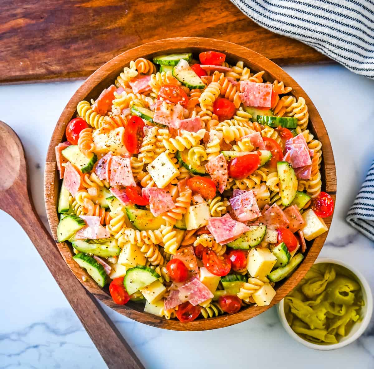 Easy Pasta Salad. This Quick and Easy Pasta Salad Recipe is made with pasta, fresh vegetables, cheese, salami, all tossed with a secret ingredient and Olive Garden Italian dressing. It is the best pasta salad recipe and the most flavorful side dish.