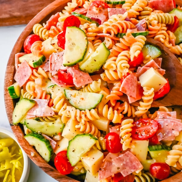 Easy Pasta Salad. This Quick and Easy Pasta Salad Recipe is made with pasta, fresh vegetables, cheese, salami, all tossed with a secret ingredient and Olive Garden Italian dressing. It is the best pasta salad recipe and the most flavorful side dish.