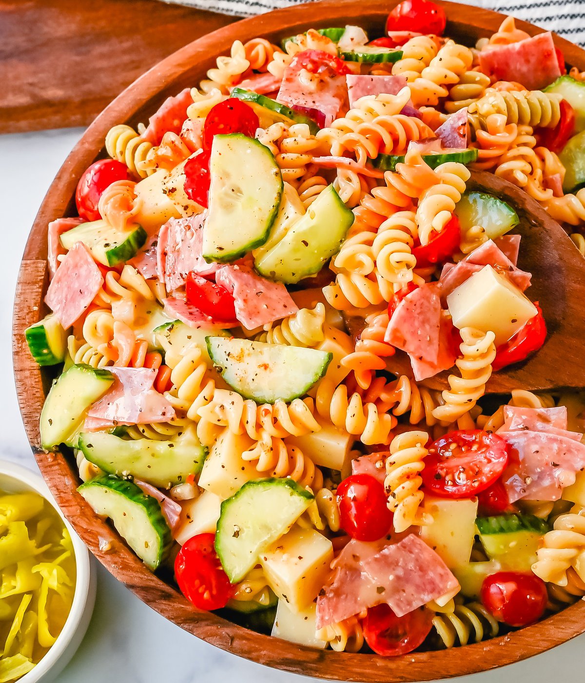 Easy Pasta Salad. This Quick and Easy Pasta Salad Recipe is made with pasta, fresh vegetables, cheese, salami, all tossed with a secret ingredient and Olive Garden Italian dressing. It is the best pasta salad recipe and the most flavorful side dish.