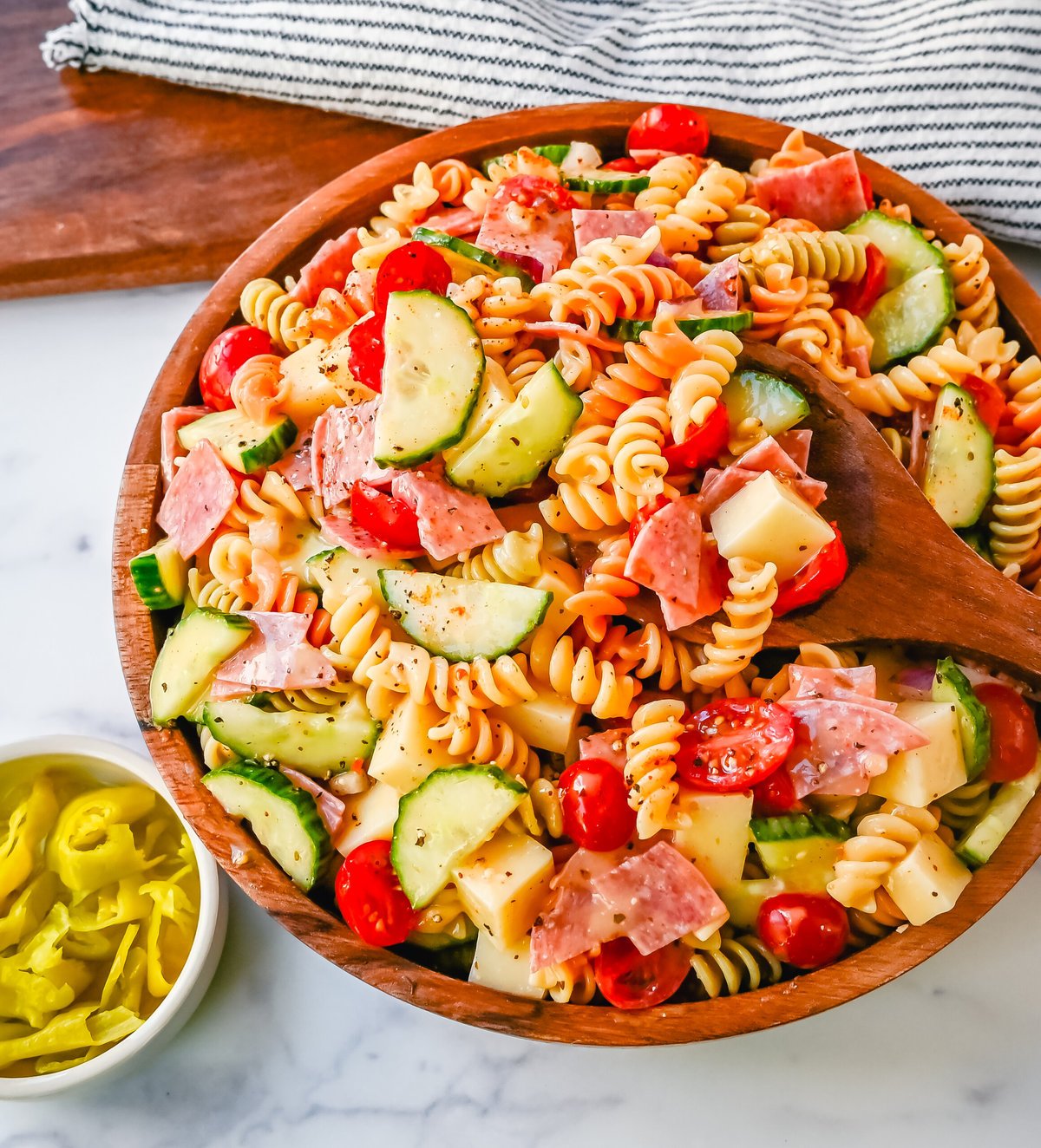 Easy Pasta Salad. This Quick and Easy Pasta Salad Recipe is made with pasta, fresh vegetables, cheese, salami, all tossed with a secret ingredient and Olive Garden Italian dressing. It is the best pasta salad recipe and the most flavorful side dish.
