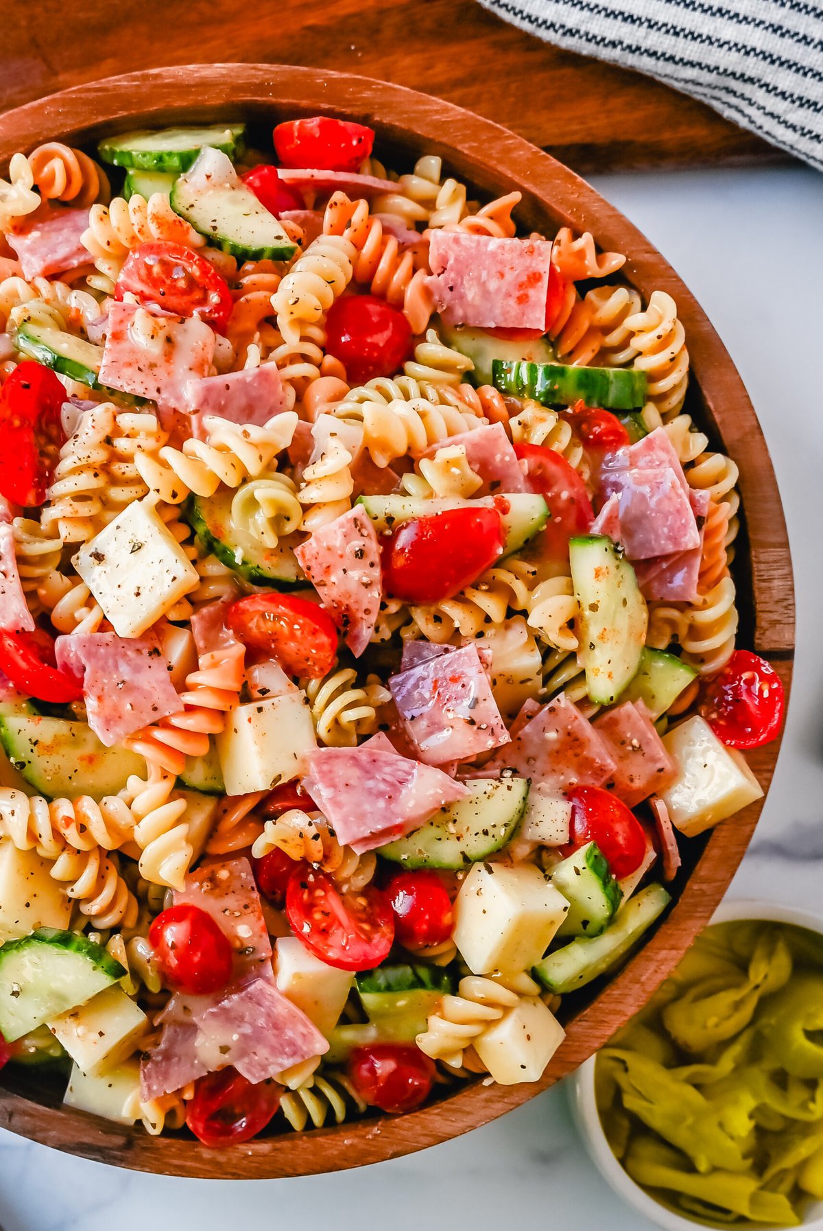 Easy Pasta Salad. This Quick and Easy Pasta Salad Recipe is made with pasta, fresh vegetables, cheese, salami, all tossed with a secret ingredient and Olive Garden Italian dressing. It is the best pasta salad recipe and the most flavorful side dish.