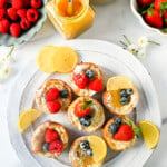 Mini Dutch Baby Pancakes (in a muffin tin). These mini, bite-size Dutch Baby pancakes are made the same way as traditional German pancakes but these are baked in muffin tins. These easy, golden and buttery mini puffed pancakes are perfect to serve to family and friends.