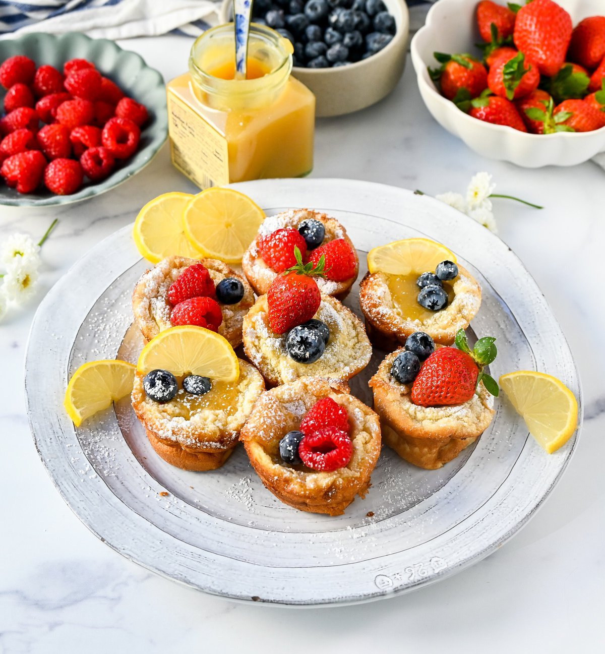 Mini Dutch Baby Pancakes (in a muffin tin). These mini, bite-size Dutch Baby pancakes are made the same way as traditional German pancakes but these are baked in muffin tins. These easy, golden and buttery mini puffed pancakes are perfect to serve to family and friends.