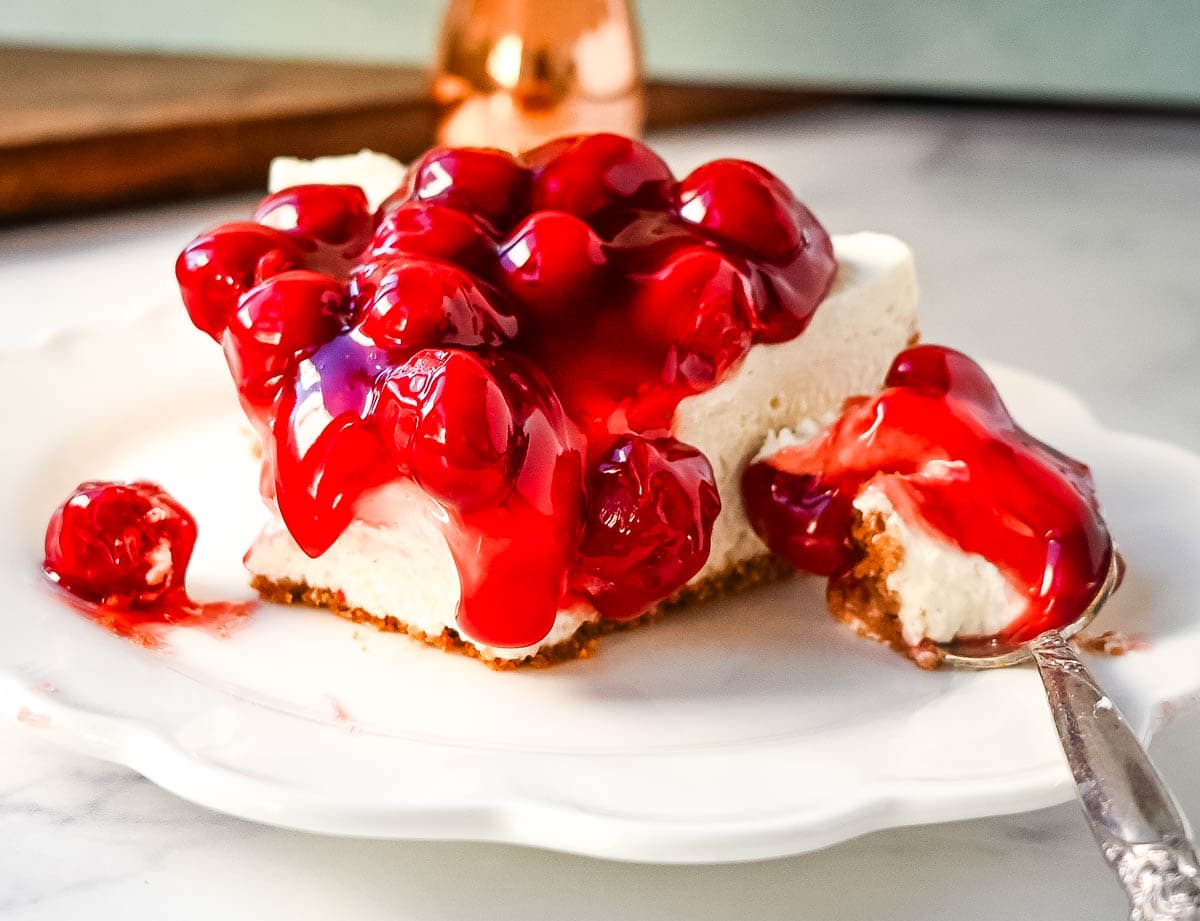 No Bake Cheesecake Recipe. This easy no bake cheesecake is made with only 7 ingredients and doesn't require baking in the oven. It has a light, creamy, velvety and rich cheesecake filling paired with a buttery crust. It is the perfect no bake dessert recipe.