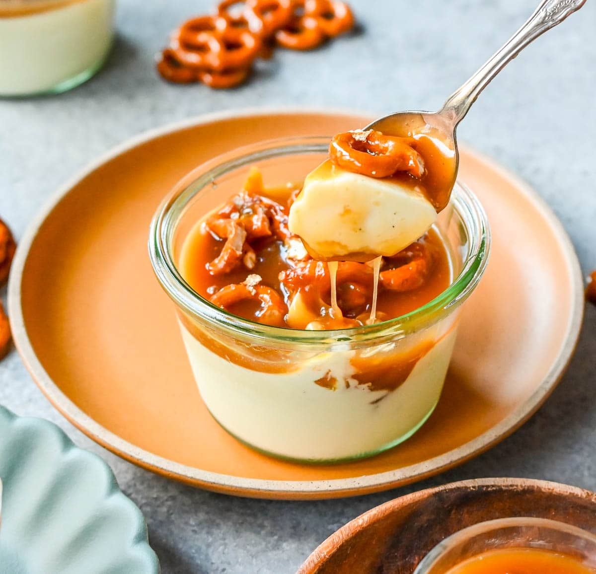 Panna Cotta with Salted Caramel and Toffee Pretzels. Creamy, rich vanilla panna cotta with homemade sea salt caramel and butter toffee pretzels. This is the perfect sweet and salty dessert!