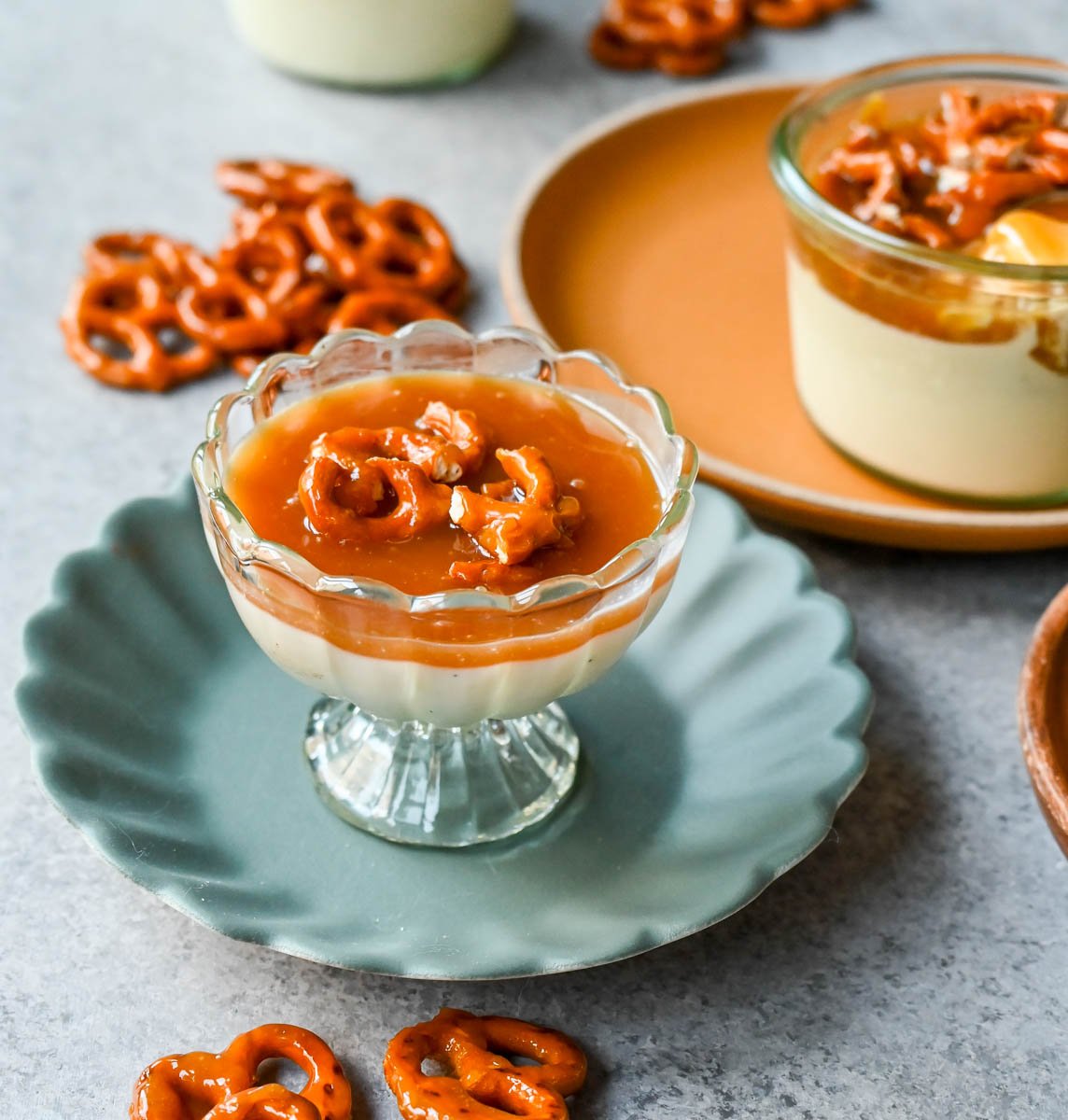 Panna Cotta with Salted Caramel and Toffee Pretzels. Creamy, rich vanilla panna cotta with homemade sea salt caramel and butter toffee pretzels. This is the perfect sweet and salty dessert!