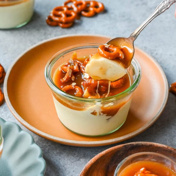 Panna Cotta with Salted Caramel and Toffee Pretzels. Creamy, rich vanilla panna cotta with homemade sea salt caramel and butter toffee pretzels. This is the perfect sweet and salty dessert!