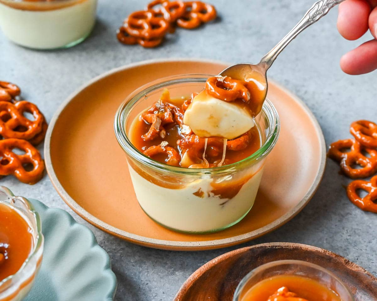 Panna Cotta with Salted Caramel and Toffee Pretzels. Creamy, rich vanilla panna cotta with homemade sea salt caramel and butter toffee pretzels. This is the perfect sweet and salty dessert!