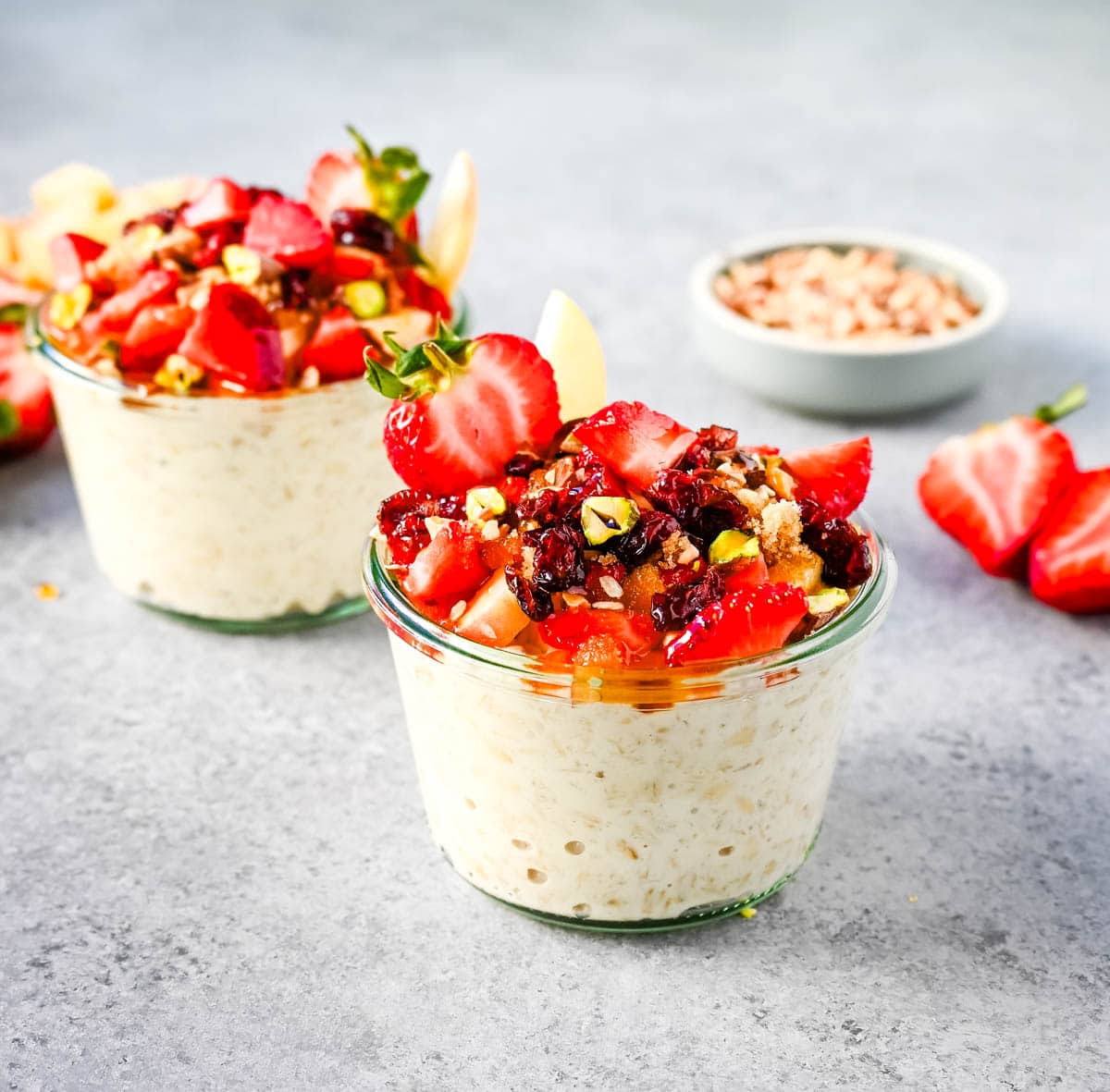 This overnight oats recipe also called Bircher Muesli is made by soaking oats overnight with juice, milk, honey, vanilla, and greek yogurt and then fold in vanilla whipped cream for extra creaminess and topped with fresh fruits, dried fruits, and nuts. It is the perfect and delicious easy, grab-and-go breakfast.
