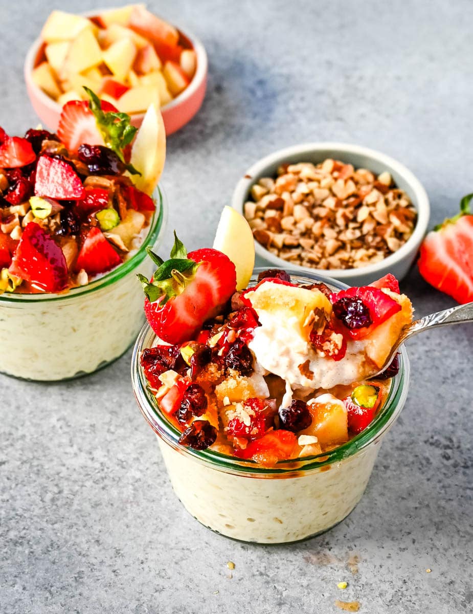 This overnight oats recipe also called Bircher Muesli is made by soaking oats overnight with juice, milk, honey, vanilla, and greek yogurt and then fold in vanilla whipped cream for extra creaminess and topped with fresh fruits, dried fruits, and nuts. It is the perfect and delicious easy, grab-and-go breakfast.