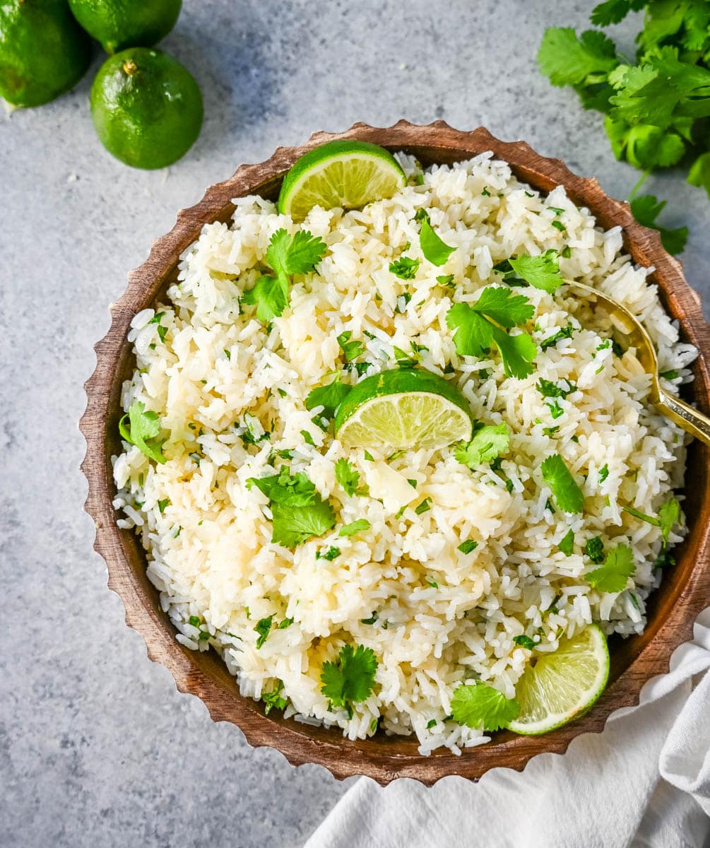 How to make the best homemade cilantro lime rice at home. This fluffy and flavorful cilantro lime rice is the perfect Mexican side dish recipe.