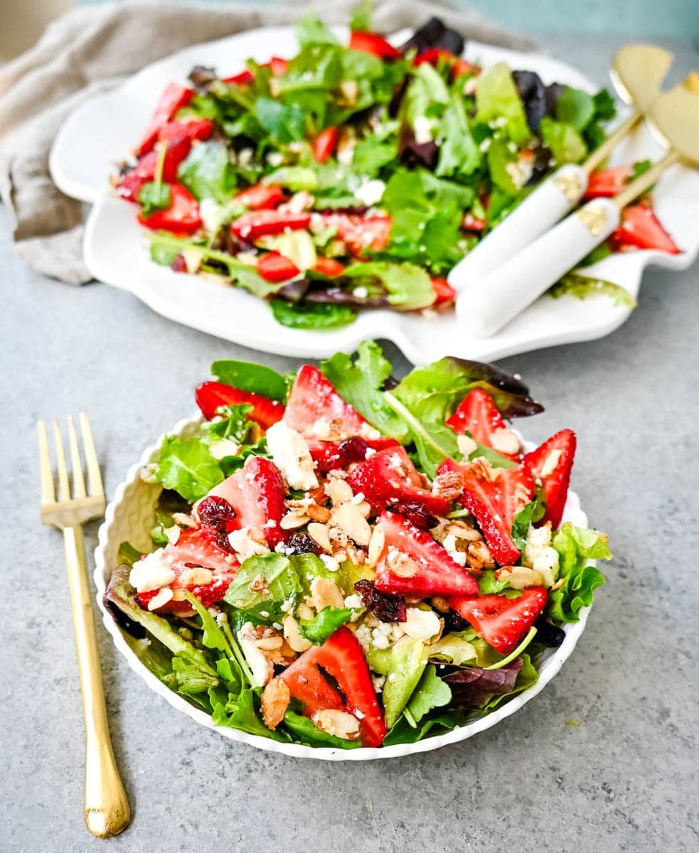 Strawberry Spring Mix Salad. This Strawberry Poppyseed Salad is made with spring mix, fresh strawberries, creamy and tangy feta cheese, sugared almonds, and tossed with a sweet homemade poppyseed dressing. 