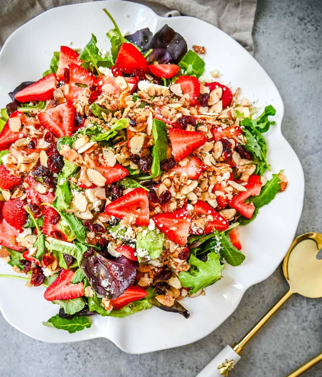 Strawberry Spring Mix Salad. This Strawberry Poppyseed Salad is made with spring mix, fresh strawberries, creamy and tangy feta cheese, sugared almonds, and tossed with a sweet homemade poppyseed dressing. 