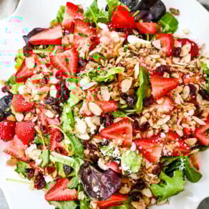 Strawberry Spring Mix Salad. This Strawberry Poppyseed Salad is made with spring mix, fresh strawberries, creamy and tangy feta cheese, sugared almonds, and tossed with a sweet homemade poppyseed dressing.