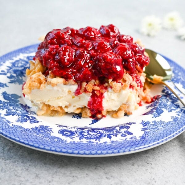 Crunchy Munchy Ice Cream Dessert. This popular ice cream dessert has a crunchy topping made with browned butter, sugar, and Rice Krispies cereal and is layered between vanilla ice cream and topped with a homemade raspberry sauce. The best ice cream dessert recipe!