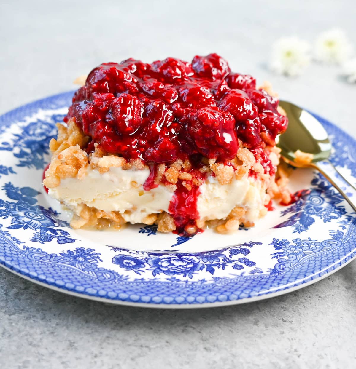 Crunchy Munchy Ice Cream Dessert. This popular ice cream dessert has a crunchy topping made with browned butter, sugar, and Rice Krispies cereal and is layered between vanilla ice cream and topped with a homemade raspberry sauce. The best ice cream dessert recipe!