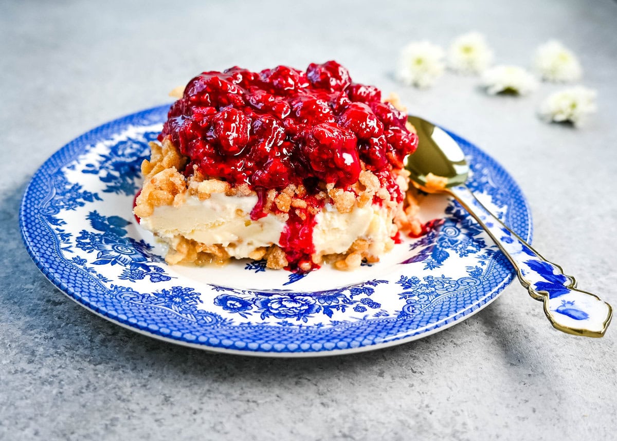 Crunchy Munchy Ice Cream Dessert. This popular ice cream dessert has a crunchy topping made with browned butter, sugar, and Rice Krispies cereal and is layered between vanilla ice cream and topped with a homemade raspberry sauce. The best ice cream dessert recipe!