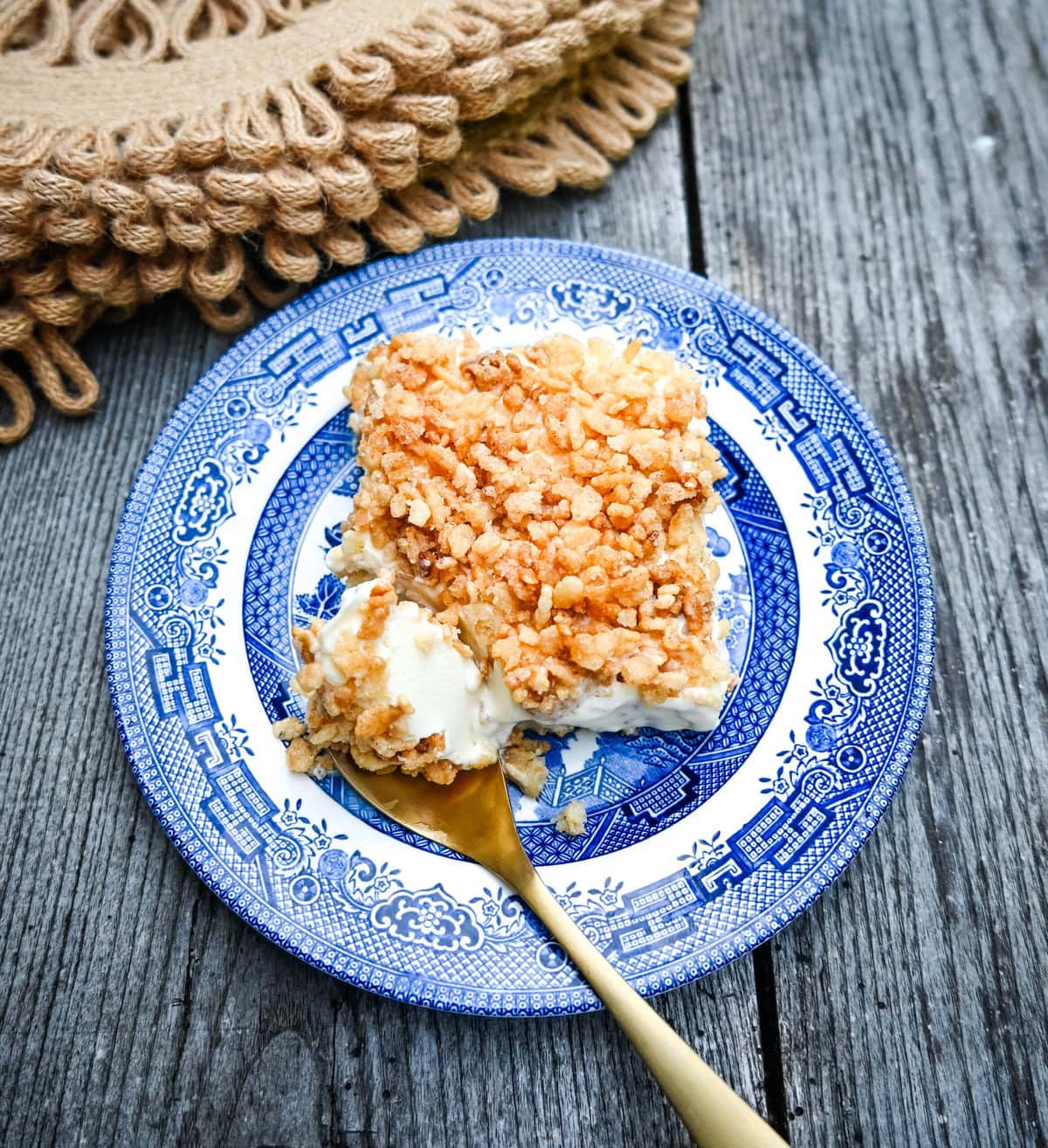 Crunchy Munchy Ice Cream Dessert. This popular ice cream dessert has a crunchy topping made with browned butter, sugar, and Rice Krispies cereal and is layered between vanilla ice cream and topped with a homemade raspberry sauce. The best ice cream dessert recipe!