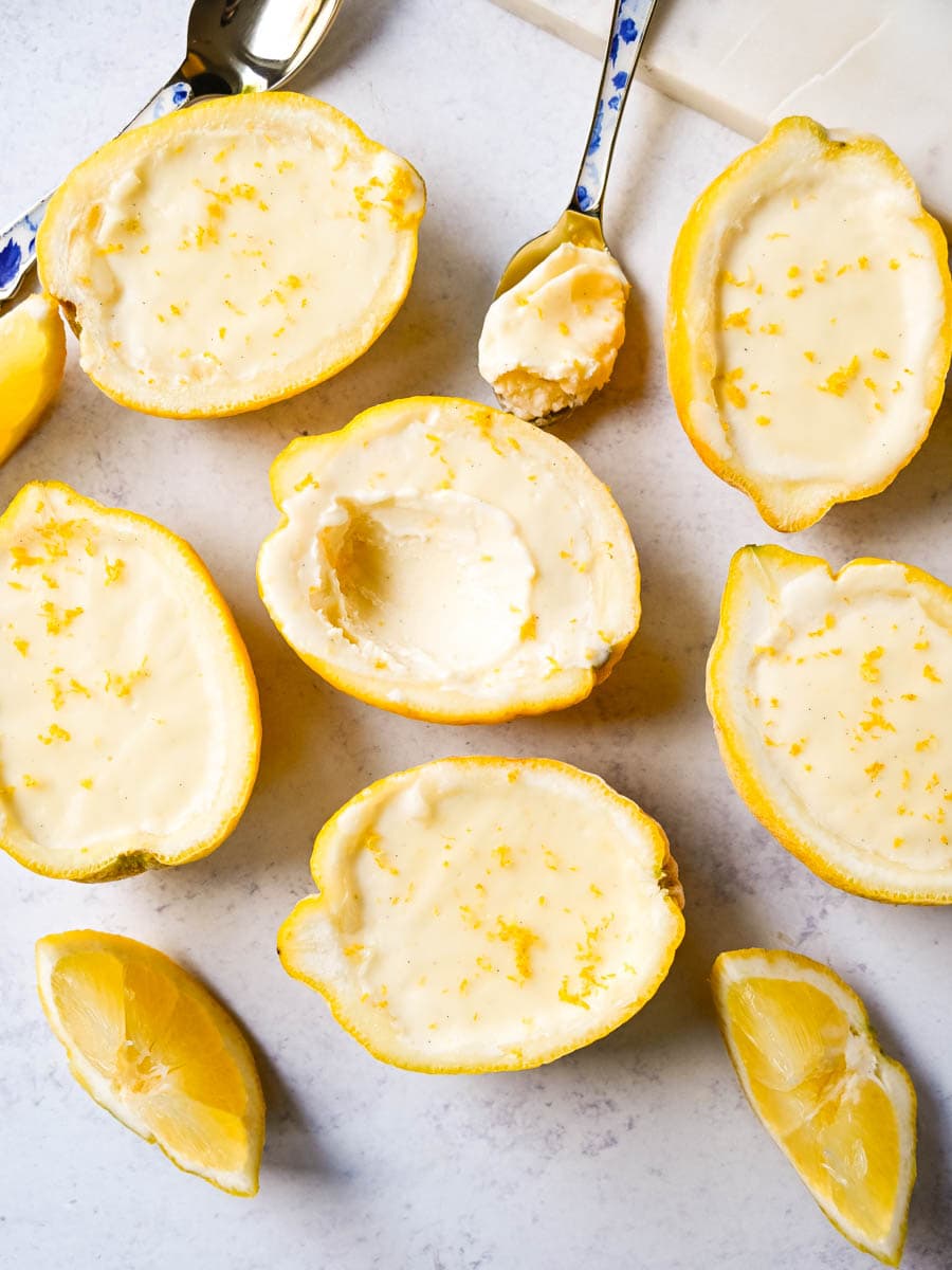 This Lemon Posset recipe is a silky, smooth, lemon custard that is so simple yet elegant and the perfect quick and easy lemon dessert. This bright and creamy lemon dessert is served in fresh lemons for a luxurious dessert.