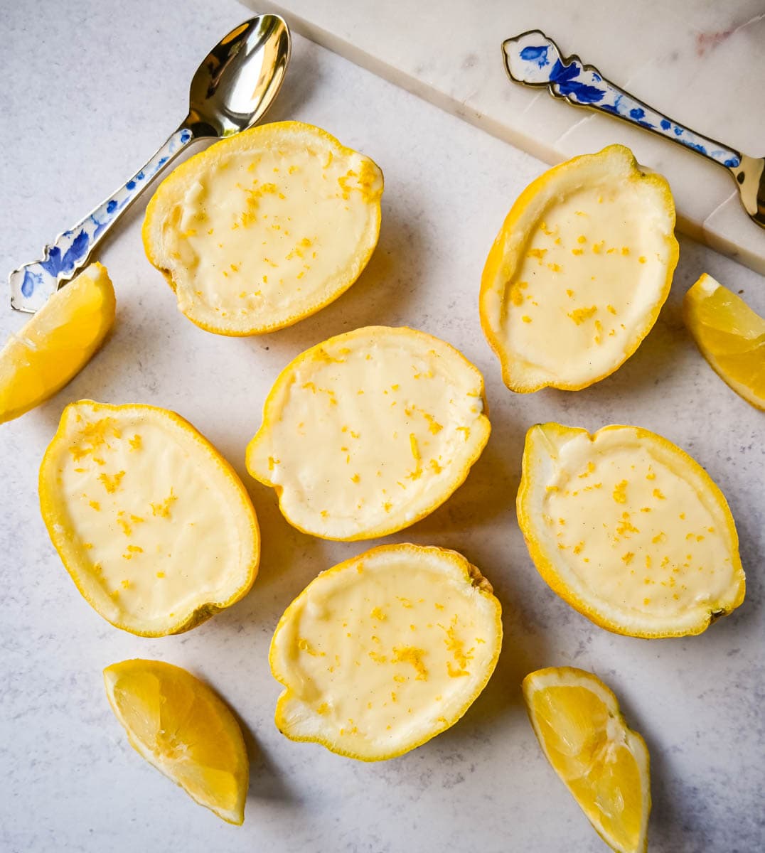 This Lemon Posset recipe is a silky, smooth, lemon custard that is so simple yet elegant and the perfect quick and easy lemon dessert. This bright and creamy lemon dessert is served in fresh lemons for a luxurious dessert.
