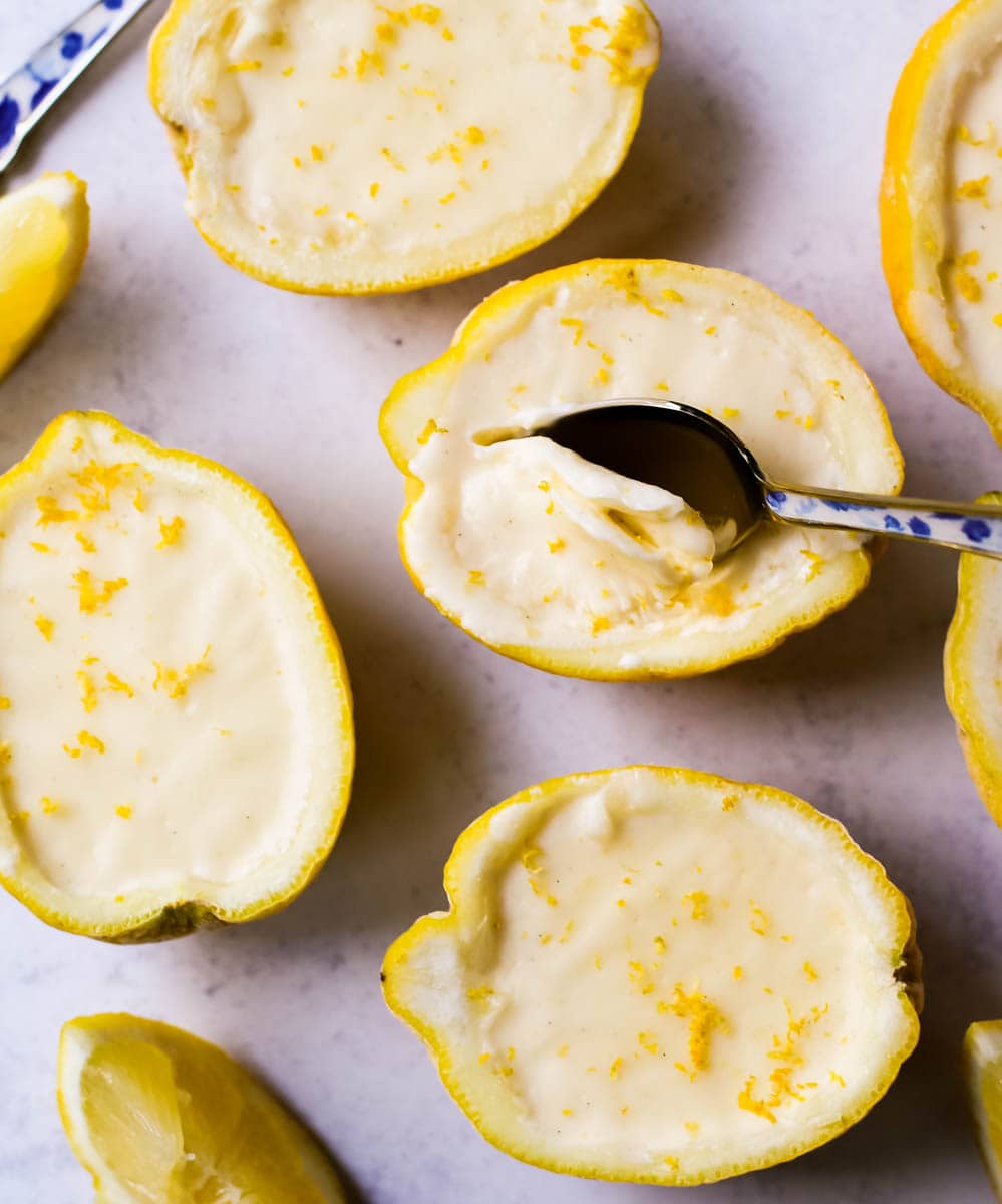 This Lemon Posset recipe is a silky, smooth, lemon custard that is so simple yet elegant and the perfect quick and easy lemon dessert. This bright and creamy lemon dessert is served in fresh lemons for a luxurious dessert.