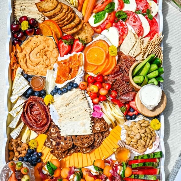 How to make an epic, beautiful Summer Charcuterie Board highlighting all of the fresh fruits and vegetables in season, paired with cheeses and meats perfect for summer. I am sharing all of the ideas on how to create the perfect charcuterie board for summer.