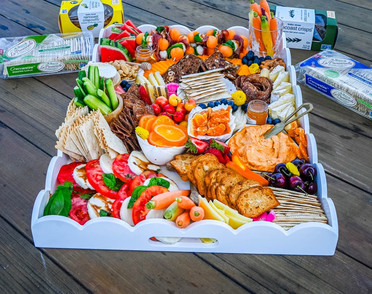 How to make an epic, beautiful Summer Charcuterie Board highlighting all of the fresh fruits and vegetables in season, paired with cheeses and meats perfect for summer. I am sharing all of the ideas on how to create the perfect charcuterie board for summer.
