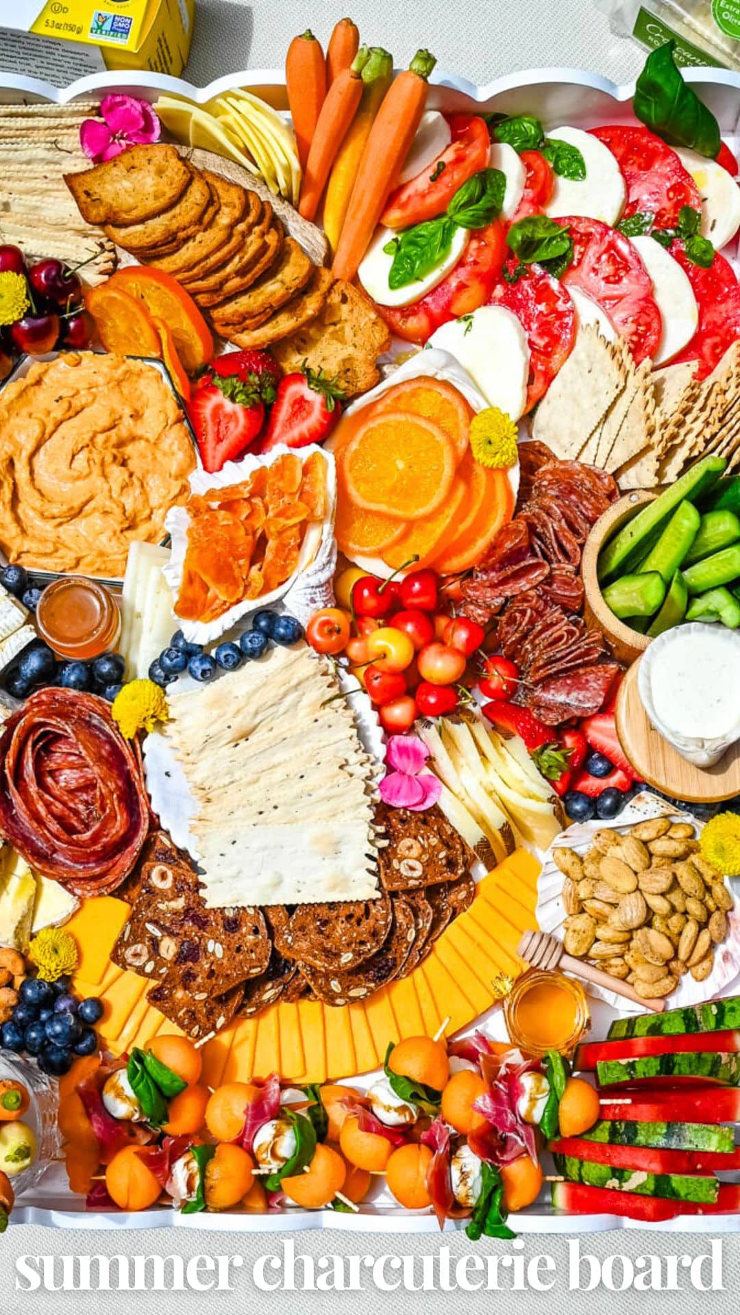 How to make an epic, beautiful Summer Charcuterie Board highlighting all of the fresh fruits and vegetables in season, paired with cheeses and meats perfect for summer. I am sharing all of the ideas on how to create the perfect charcuterie board for summer.