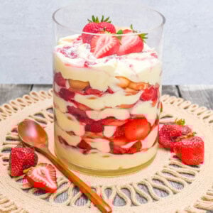 This Magnolia Bakery Strawberry Shortcake Pudding is such a quintessential summer dessert. It is made with fresh or roasted strawberries in a creamy vanilla pudding and whipped cream with Nilla wafers. This Strawberry Shortcake Pudding will be your favorite no-bake summer dessert recipe. This strawberry trifle will be a hit!