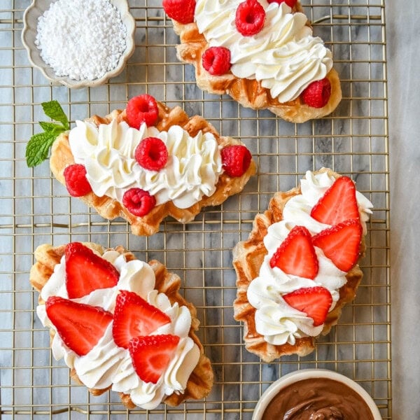 How to make the famous croffle which is croissant dough baked in a waffle iron that makes a buttery, flaky waffle that is the perfect breakfast or dessert recipe. A croffle is the ultimate fusion of a buttery, flaky croissant and a golden, crispy waffle. Top it with your favorite waffle toppings!