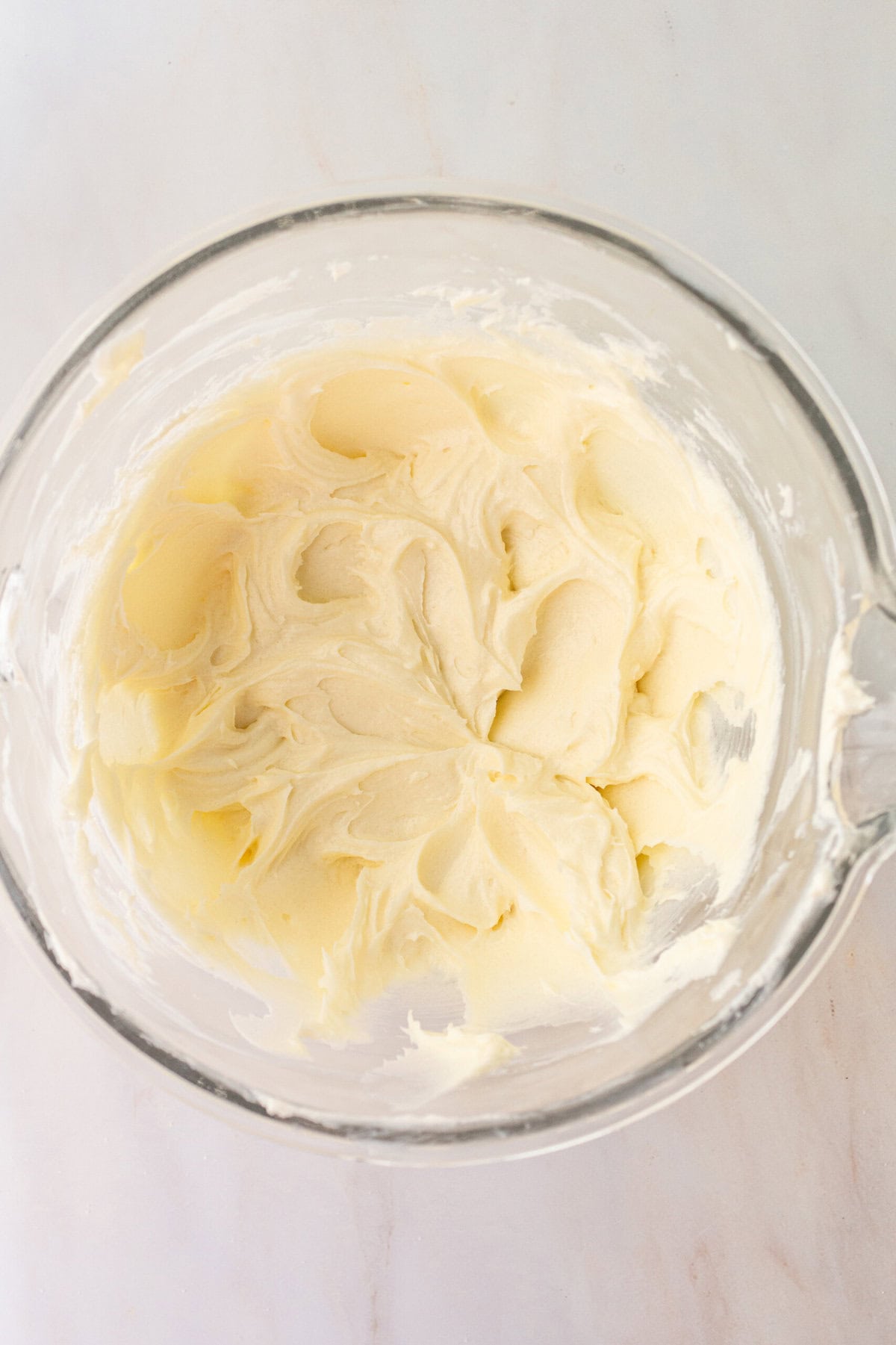 Cheesecake Bars Cheesecake Filling whipped in a bowl. How to make the filling for cheesecake bars.