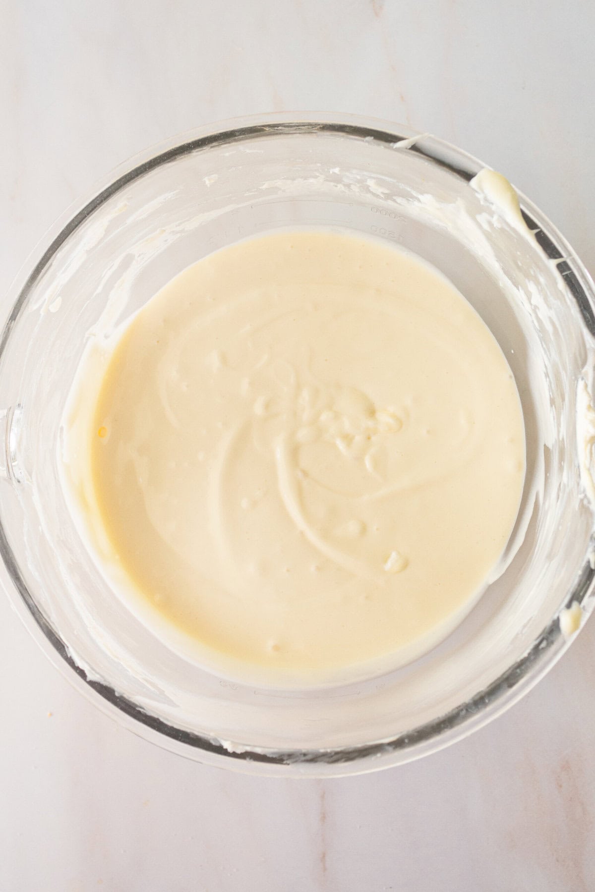 Cheesecake Bars Cheesecake Filling whipped in a bowl. How to make the filling for cheesecake bars.