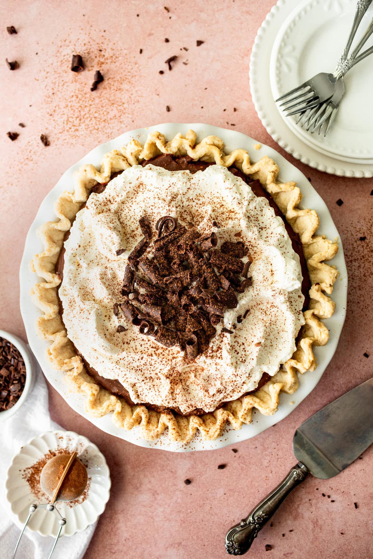 This is the best Chocolate Cream Pie recipe made with decadent chocolate custard in a flaky, buttery crust and topped with homemade whipped cream and chocolate shavings. You will love this chocolate pie recipe! 
