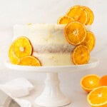 A moist, tender fresh orange cake with a sweet orange cream cheese frosting. This homemade orange cake that is bursting with bright citrus flavor in every bite. Each layer is moist, fluffy, and perfectly enhanced by an orange cream cheese frosting. The fresh orange juice and zest adds fresh orange flavor. Here are tips for making the perfect frosted orange cake! This can also be made into an orange naked cake.