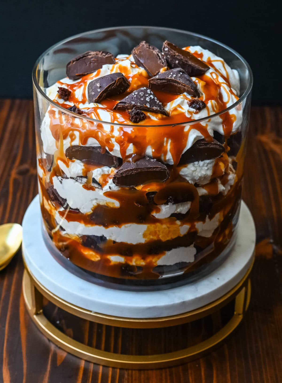 This Salted Caramel Brownie Cheesecake Trifle is made layers of rich, fudgy brownies, creamy cheesecake filling, salted caramel, homemade whipped cream, and chocolate covered caramels. This is the perfect sweet dessert to impress your guests and is such a crowd pleaser!