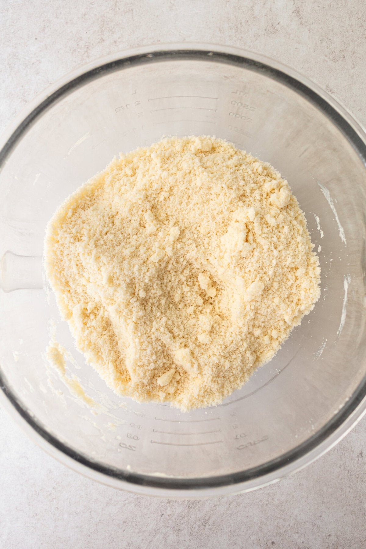 Making homemade coconut cake batter in a bowl