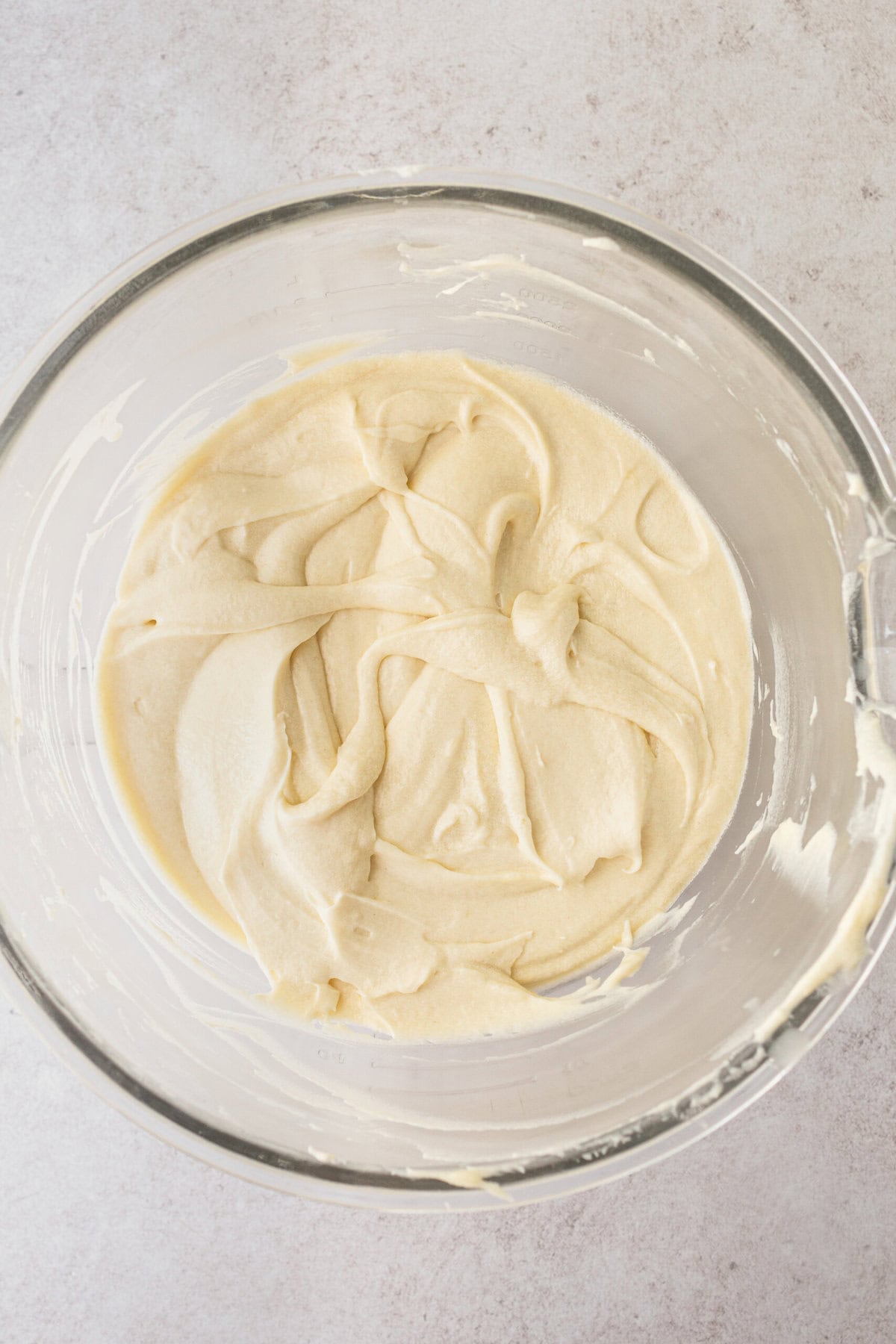Homemade Coconut Cake Batter in a bowl. How to make coconut cake.