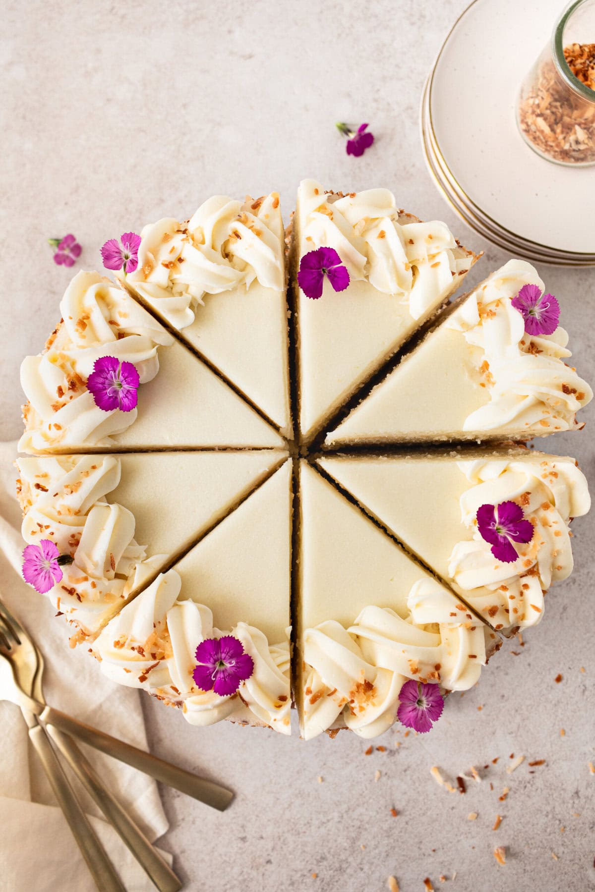 This homemade, moist coconut cake with coconut cream cheese frosting is the best coconut cake recipe. It is made with sweet cream butter, coconut milk, buttermilk, coconut pudding mix, and cake flour to make it extra tender. The coconut cream cheese frosting puts it over the top!