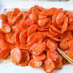 These Roasted Carrots with a Maple Brown Sugar Glaze are carrots roasted in butter, real maple syrup, brown sugar, and a touch of red pepper flakes. These maple glazed carrots are sweet and savory and a perfect side dish recipe.
