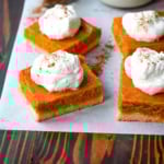 These homemade Pumpkin Pie Bars are made with a buttery shortbread crust and topped with a creamy pumpkin cream cheese filling and baked. These easy pumpkin pie bars are topped with fresh whipped cream and cut into squares for an easy alternative to pumpkin pie.