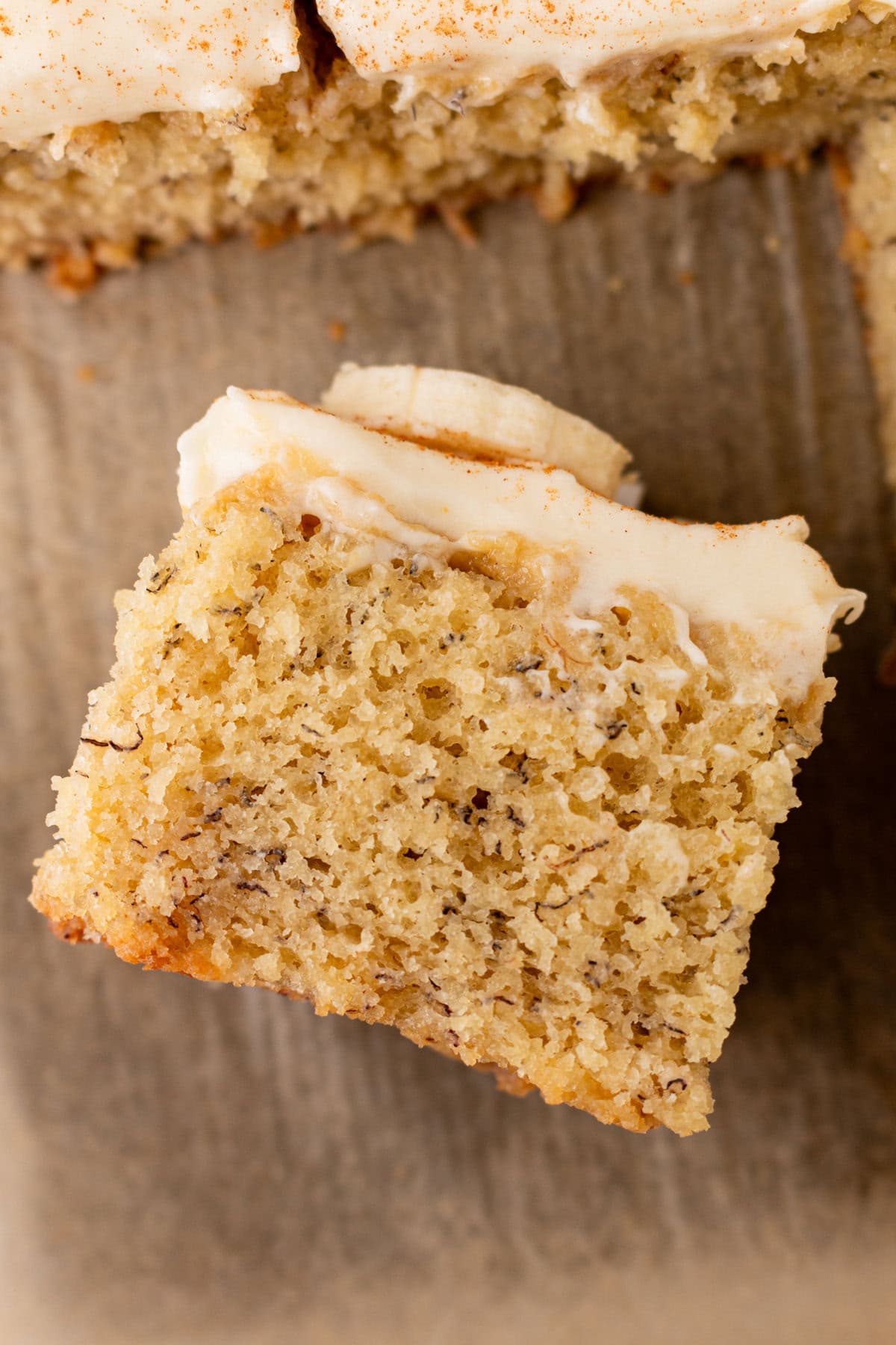 Jeff's BEST Banana Cake Recipe is a moist and tender banana cake with a creamy, sweet, and buttery cream cheese frosting. Some say it is the best banana cake in the world! This moist banana cake with cream cheese frosting is baked in a 9×13 pan and is always a hit!